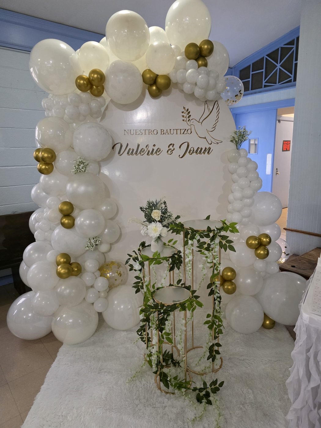 White balloon and botanical backdrop for an elegant formal celebration