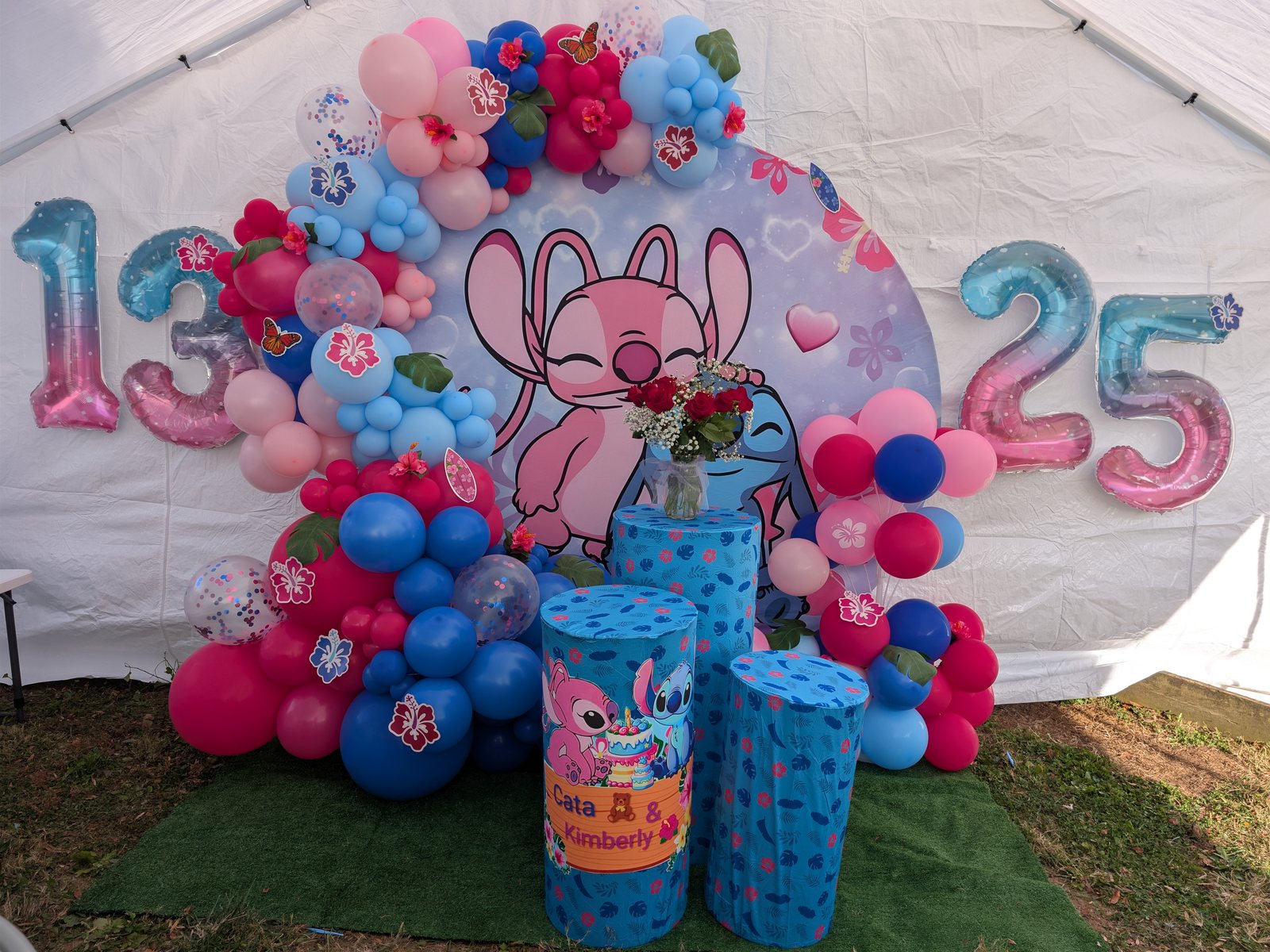 Blue, pink, and hot pink balloon birthday backdrop with custom character theme